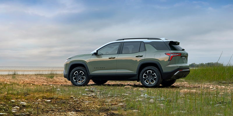 Chevrolet Equinox parked near an ocean on a cloudy day